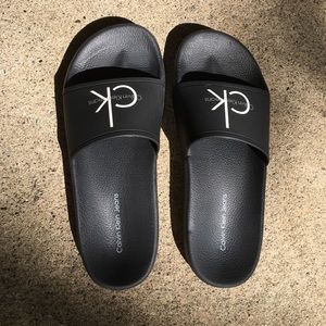 Black Calvin Klein slip ons